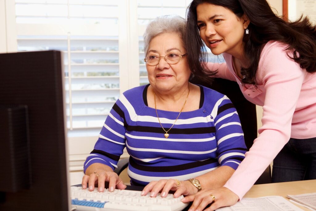 women in front of computer