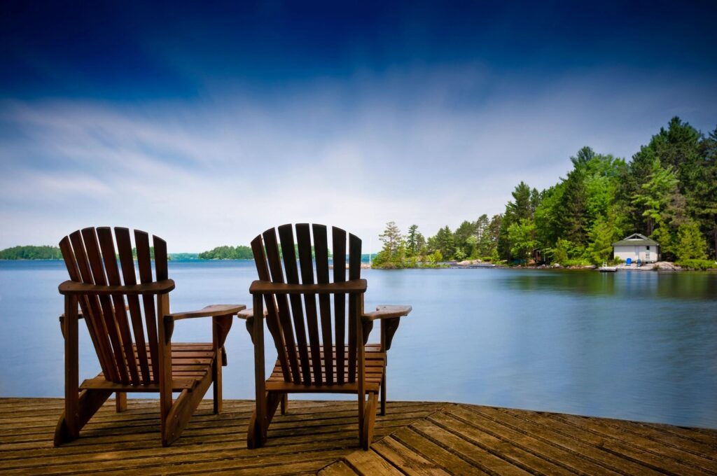 two chairs by a lake