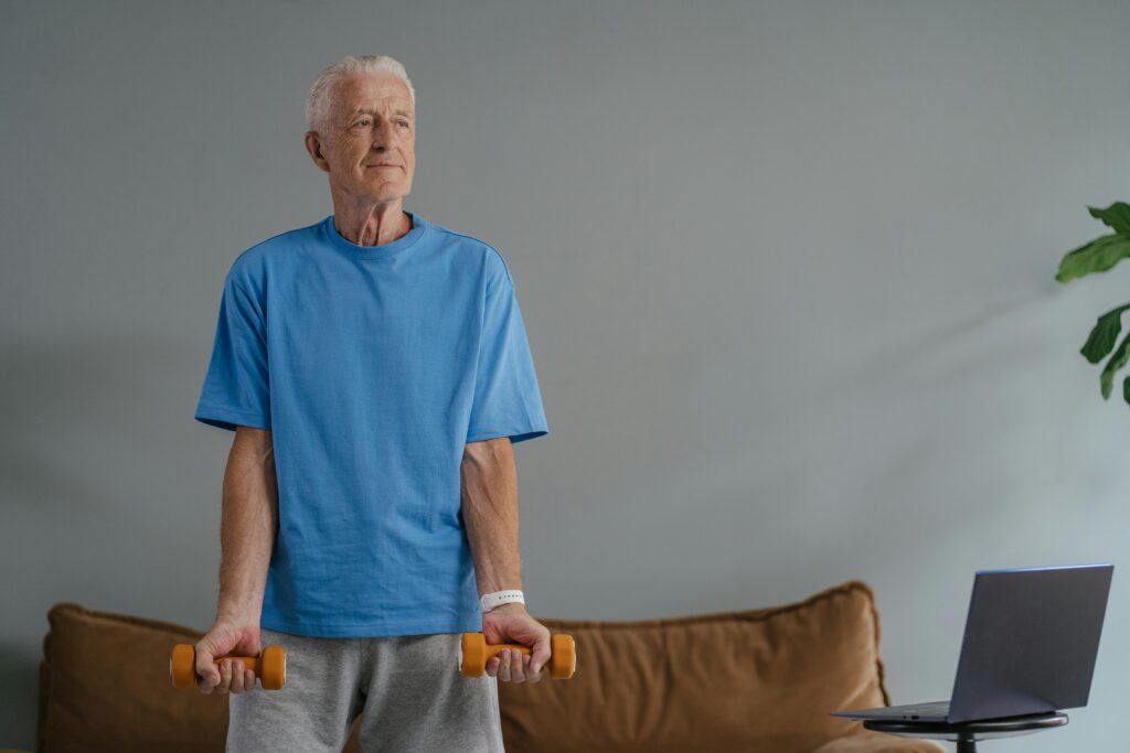 senior man using handweights