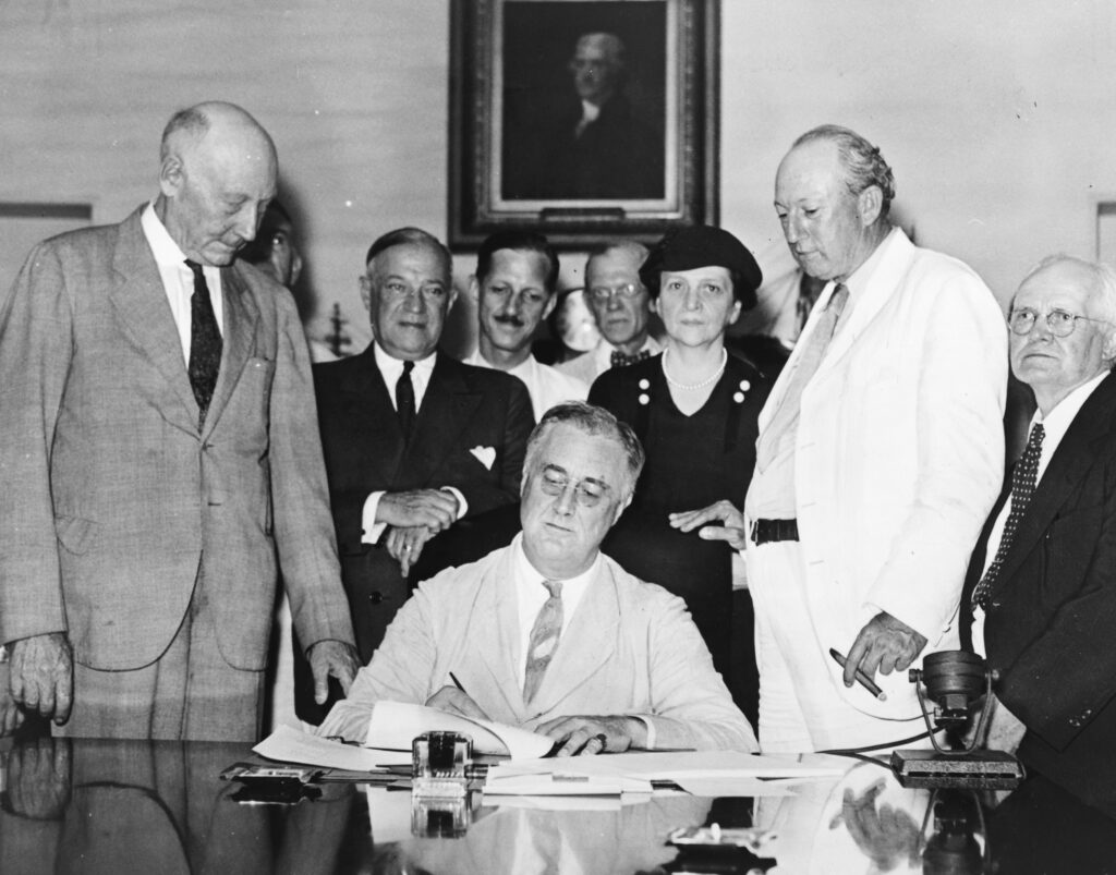 FDR signs Social Security Act